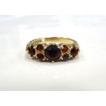 GARNET CLUSTER RING on nine carat gold shank,