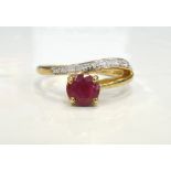 RUBY AND DIAMOND RING the central round brilliant cut ruby approximately 0.