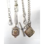 TWO SILVER ALBERT CHAINS with two medal fobs,