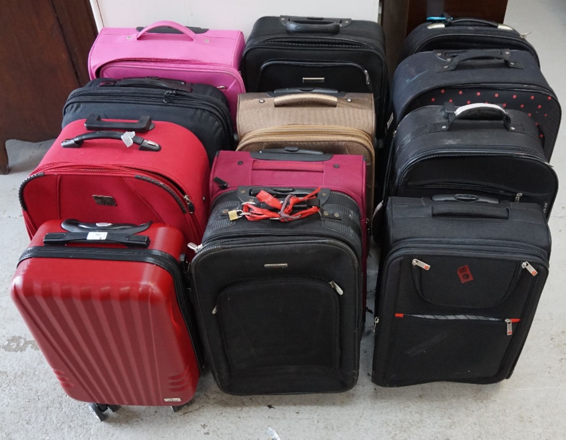 SELECTION OF TWELVE SUITCASES Various sizes.