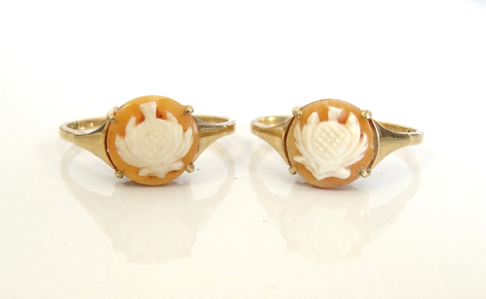 TWO CAMEO RINGS both depicting thistles, on nine carat gold shanks,