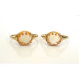 TWO CAMEO RINGS both depicting thistles, on nine carat gold shanks,