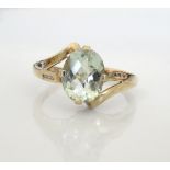 AQUAMARINE AND DIAMOND RING the central oval cut aquamarine approximately 2.