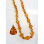 AMBER BEAD NECKLACE AND AMBER PENDANT the necklace with alternating diamond shaped and circular