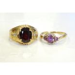 TWO DIAMOND AND GEM SET RINGS comprising an amethyst and diamond twist set ring in nine carat gold;