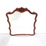 LARGE CHINESE TEAK MIRROR of shaped outline surmounted by a carved and pierced fleur de lis motif,