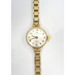 LADY'S NINE CARAT GOLD CASED JAQUET DROZ WRISTWATCH the silvered dial with Arabic numerals,
