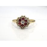 RUBY AND DIAMOND CLUSTER RING on nine carat gold shank,