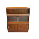 'THE SIMPLEX' SECTIONAL BOOKCASE in mahogany with a shaped edge top above two sections with glass