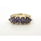 BLUE GEM SET CLUSTER RING possibly blueberry quartz, on nine carat gold shank,