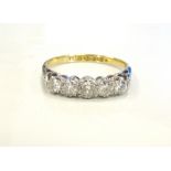 GRADUATED DIAMOND FIVE STONE RING in eighteen carat gold and platinum,