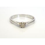 DIAMOND SOLITAIRE RING on eighteen carat white gold shank, ring size O,