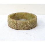 CHINESE CARVED JADE BANGLE with decorative design, 8.