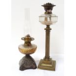 TWO VICTORIAN OIL LAMPS one with brass column base, duplex burner and faceted glass reservoir,