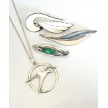 FOUR PIECES OF DESIGNER SILVER JEWELLERY comprising a Norwegian white enamel decorated silver