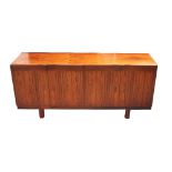 1970's TEAK SIDEBOARD with two pairs of cupboard doors with top recessed handles,