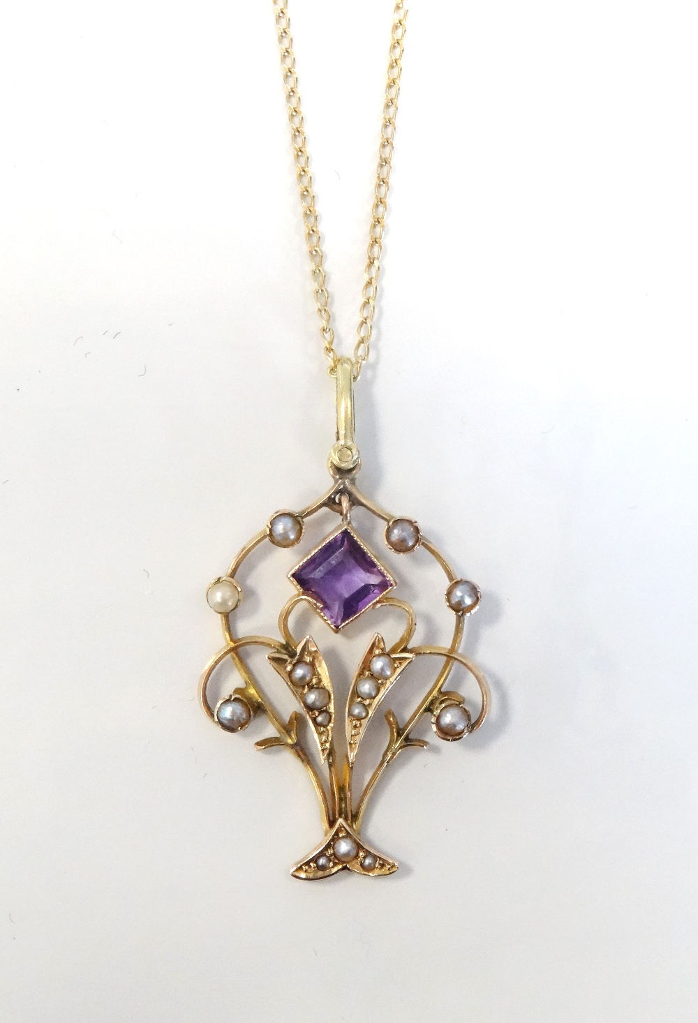 AMETHYST AND SEED PEARL HOLBEIN PENDANT in nine carat gold and on nine carat gold chain