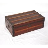 WOODEN BANDED TRAVEL TRUNK with a lift up lid, side and front carrying handles, 83.