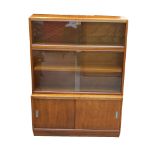 'THE SIMPLEX' SECTIONAL BOOKCASE in mahogany with a shaped edge top above an upper section with