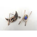 TWO OLA MARIE GORIE SILVER BROOCHES one in the form of a crescent moon and pair of compasses,