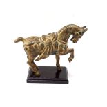 TANG STYLE METAL HORSE with bronzed patination, raised on plinth base, 22.