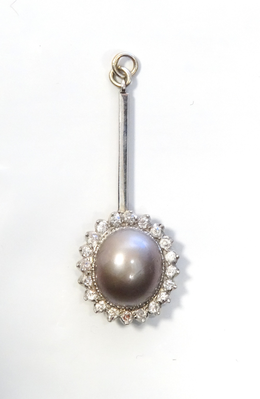 ATTRACTIVE DIAMOND AND GREY PEARL CLUSTER PENDANT the central pearl in twenty diamond surround,