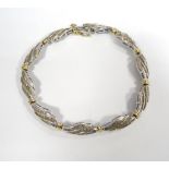 MULTI DIAMOND SET BRACELET in ten carat gold,