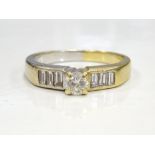 DIAMOND RING the central round brilliant cut diamond approximately 0.