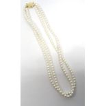 DOUBLE STRAND PEARL NECKLACE with diamond set pierced nine carat gold clasp,