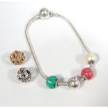 PANDORA SILVER ESSENCE BRACELET with four essence charms;