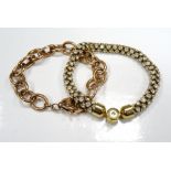 MICHAEL KORS BRACELET in gold tone set with crystals overall;