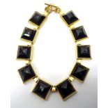 LARGE MICHAEL KORS NECKLACE with square black faceted links in gold tone,