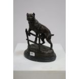 after WALTON A BRONZE GROUP OF A BULLHOUND SHOWN CLIMBING A FENCE ON AN OVAL MARBLE BASE 32cm high