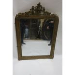 A 19TH CENTURY GILT PLASTER OVERMANTLE MIRROR the moulded frame headed by a foliate cartouche with