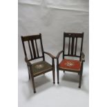 A PAIR OF EARLY 20th CENTURY MAHOGANY FRAMED OPEN ARMCHAIRS the rectangular panelled backs carved