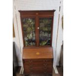 A GEORGIAN MAHOGANY AND SATINWOOD BANDED BUREAU BOOKCASE the moulded cornice above the recessed