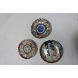 A COLLECTION OF THREE ORIENTAL GLAZED AND PAINTED PORCELAIN PLATES with waved rims the white