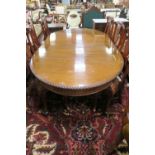 A GEORGIAN STYLE MAHOGANY DINING ROOM TABLE the rectangular top with rounded ends and gadrooned rim