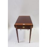 A GEORGIAN STYLE MAHOGANY CROSS BANDED DROP LEAF TABLE the rectangular top with canted corners