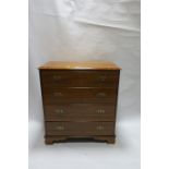 A MAHOGANY CHEST OF DRAWERS IN GEORGIAN STYLE the rectangular top with moulded rim above four long