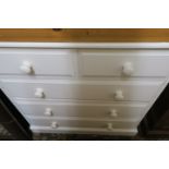A WHITE PAINTED PINE CHEST OF DRAWERS,