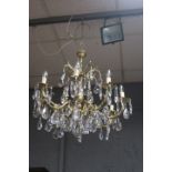 A CONTINENTAL STYLE GILT FRAMED EIGHT LIGHT CHANDELIER,