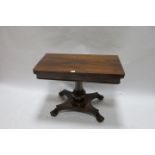 A REGENCY ROSEWOOD FOLD OVER TOP TABLE,