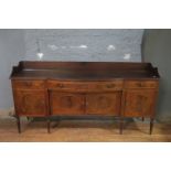 AN EARLY 19TH CENTURY MAHOGANY AND SATINWOOD BANDED SIDEBOARD, of breakfront boad outline,