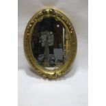 A CONTINENTAL GILTWOOD AND GESSO MIRROR,