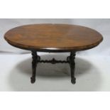 A VICTORIAN WALNUT SUPPER TABLE,