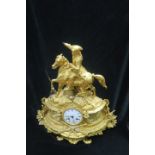 A FINE FRENCH GILT METAL CLOCK, surmounted with a Cavalier on Horseback,