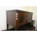 A GEORGIAN TWO DOOR SIDE CABINET with marquetry inlay on castors