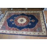 A WOOL AND SILK RUG,