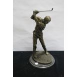 A BRONZE FIGURE, modelled as a golfer shown standing on a naturalistic base, 43cms high.